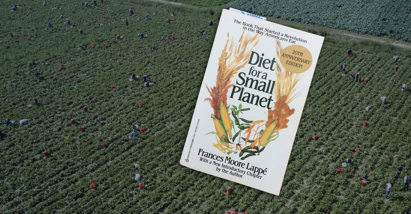 The book, Diet for a Small Planet, floats over a field of farm workers.