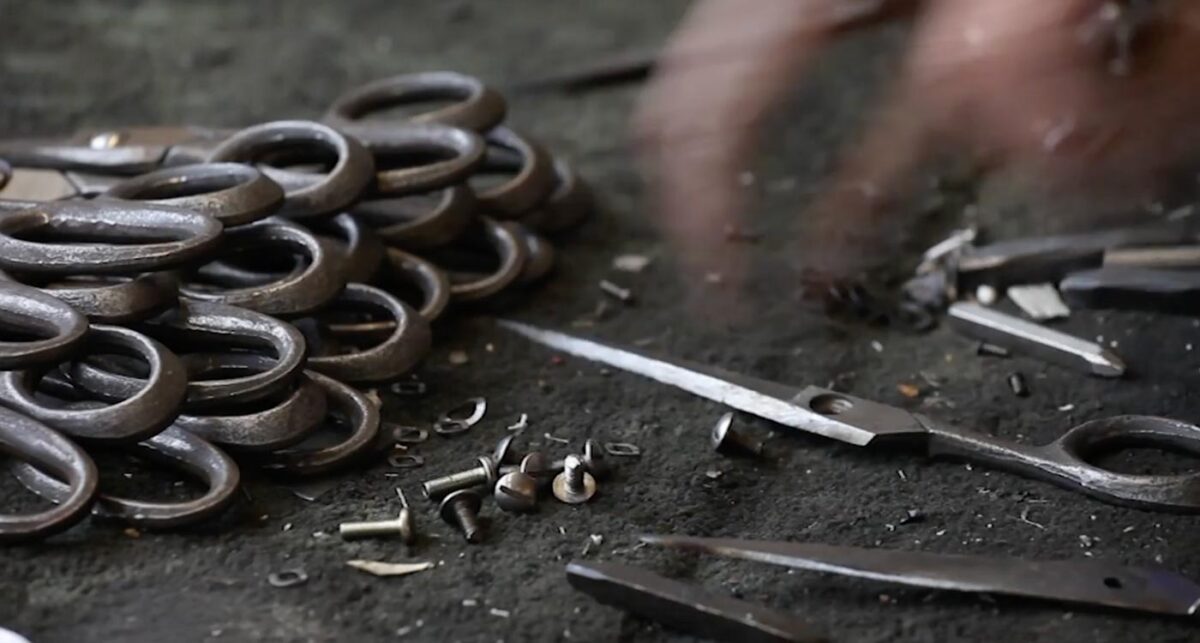 Scissors, made and designed by Ernest Wright, lying in a pile before they're polished.